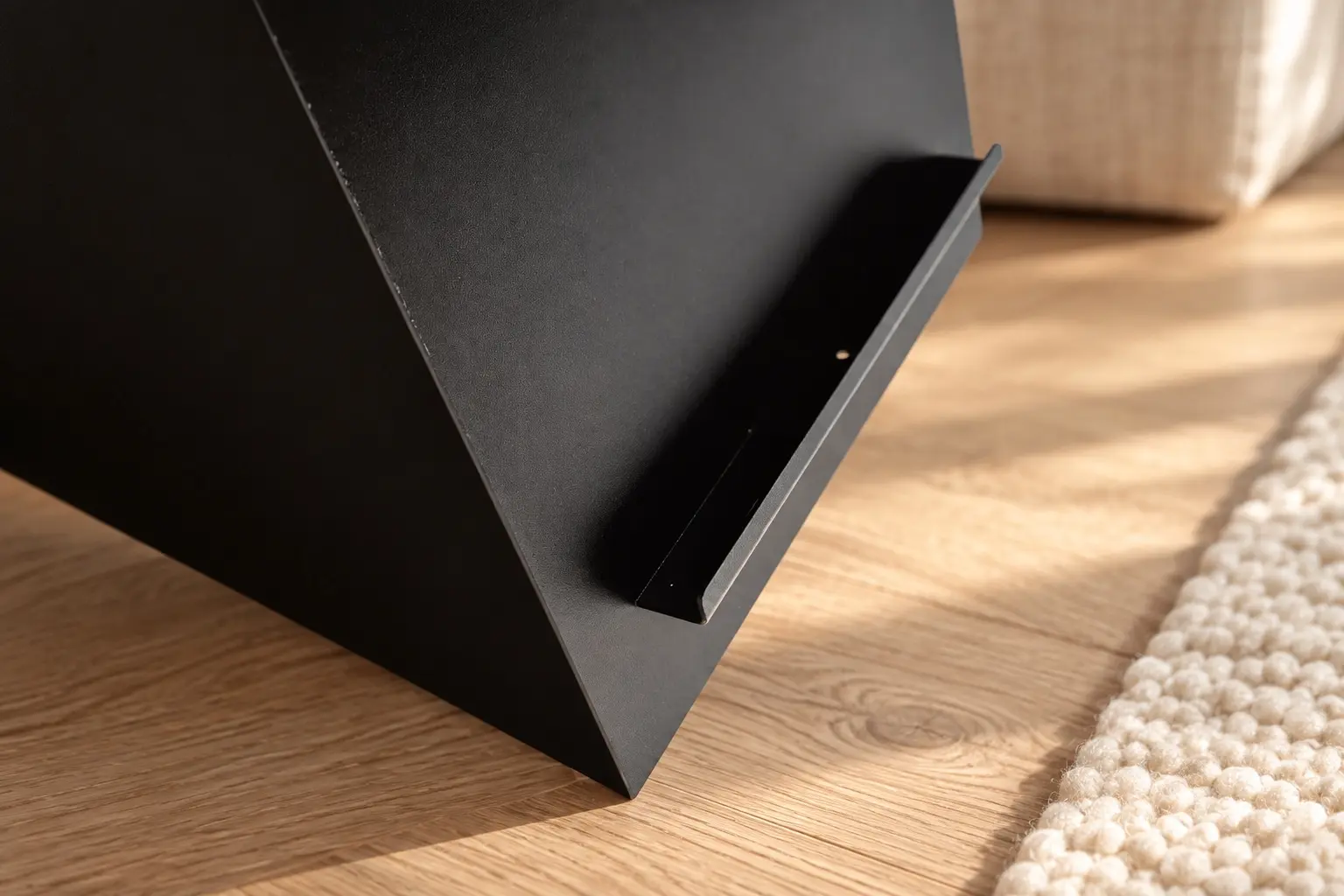 Close-up of Trinity Metal Side Table craftsmanship on a warm oak floor