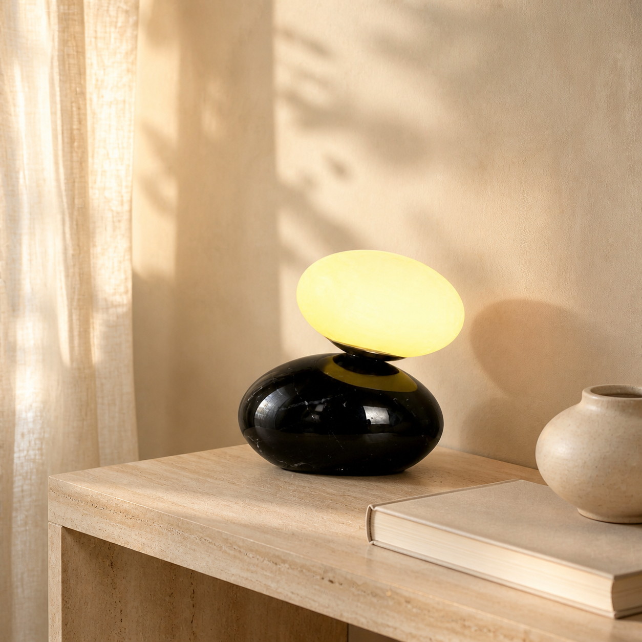 Halo black table lamp glowing warmly